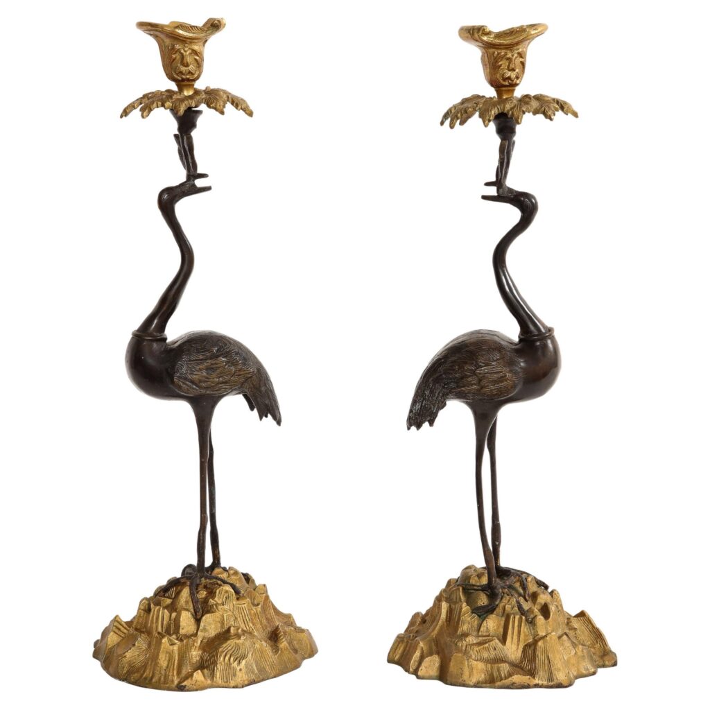 Pair of 19th Century Patinated and Gilt Bronze Standing Crane-Form Candlesticks