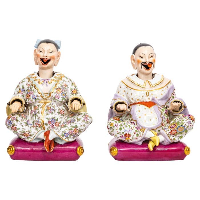 A Pair of 19th Century Dresden Porcelain Nodding Head Figures seated on Pillows